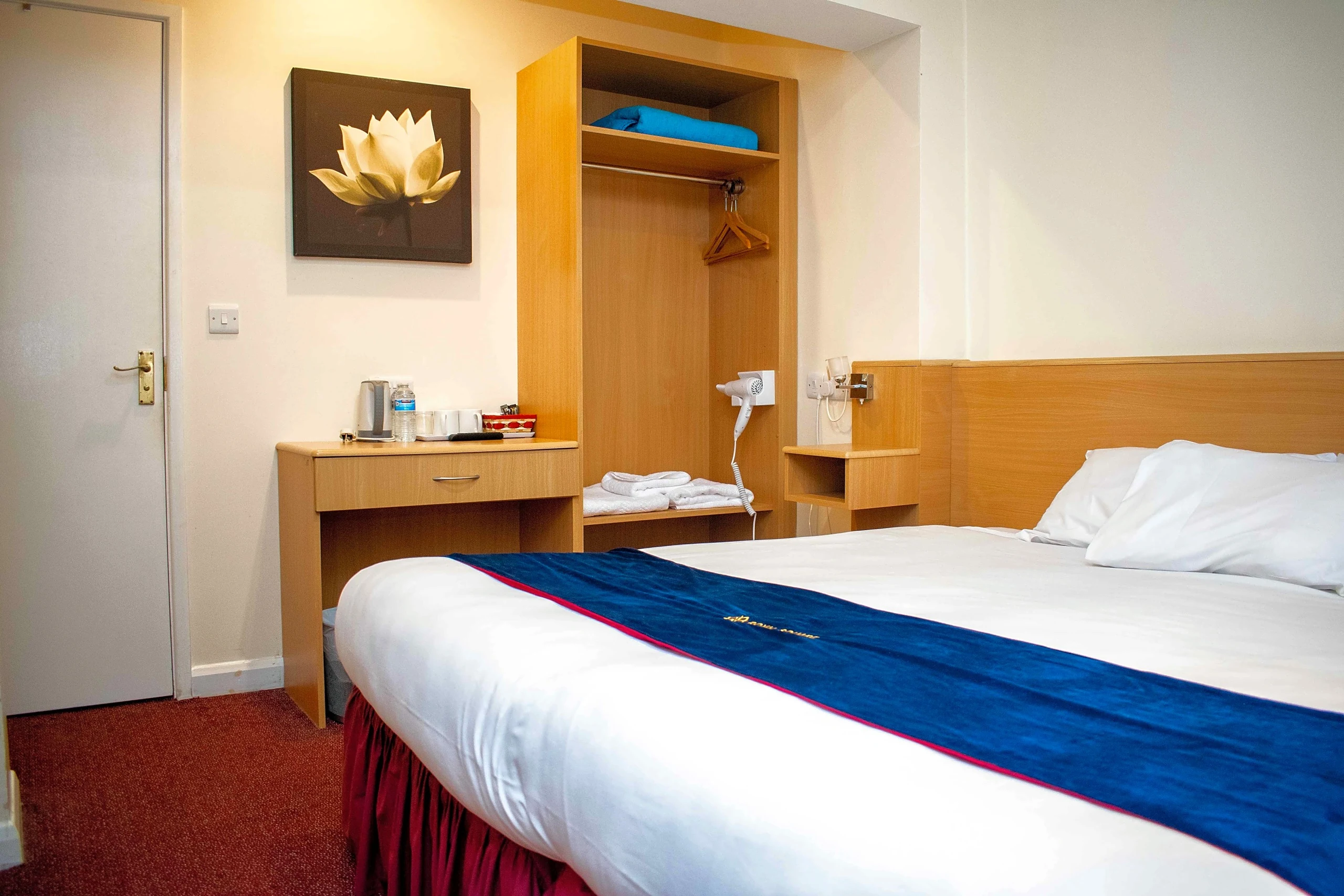 Classic Double Room with a double bed, desk and wardrobe